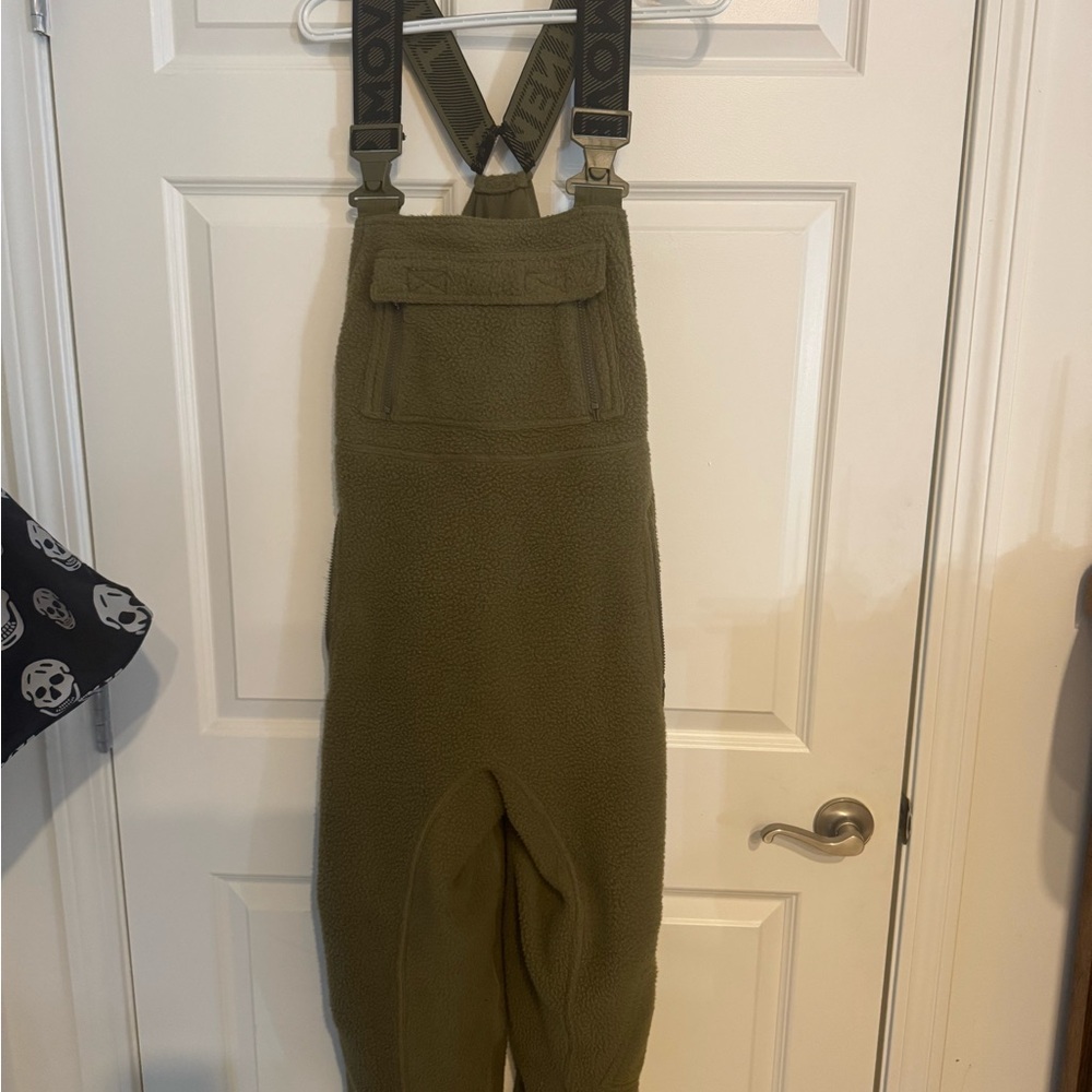 Free movement by free people. Army green, fuzzy overalls.